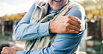 Construction, hands and mature man with shoulder pain, accident and workplace injury on site. Contractor, engineering and person with joint ache, strain and hurt for tension, fibromyalgia and sprain