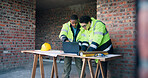Team, laptop and engineers at construction site for development, safety compliance or architecture. Planning, computer and men with discussion for building design, quality assurance or protocol