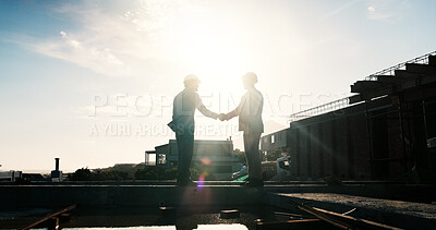 Buy stock photo Construction, silhouette or men on rooftop with handshake, greeting or deal in building project. Space, flare or engineer with shaking hands, partnership agreement or approval in industrial expansion