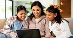 Laptop, mother and children in home for bonding, smile or streaming movie with Asian family. Computer, happy girls and parent on sofa to watch film together on weekend, show or cartoon with sisters