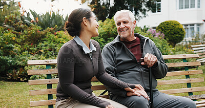 Buy stock photo Support, holding hands and old man with caregiver at garden for wellness, rehabilitation and relax. Carer, retirement and happy person outdoor with cane, trust and bonding for connection on bench