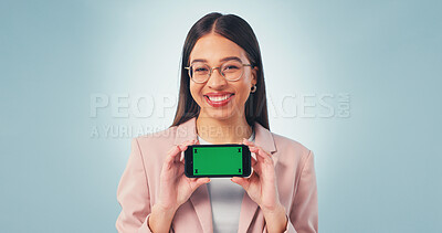 Buy stock photo Portrait, businesswoman and phone in studio with green screen, smile and website for digital marketing. Happy, person and worker with tech, advertising mobile app and mockup space on blue background.