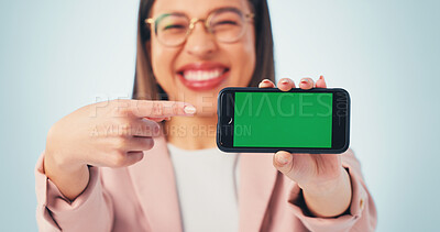 Buy stock photo Pointing, green screen or hands of businesswoman with phone for advertising finance app. Happy, presentation or financial advisor with cellphone mockup space for internet banking on studio background