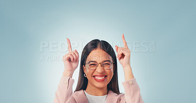 Buy stock photo Excited, business and woman point in studio, advertising and announcement for interview. Portrait, mockup space and happy with person, application and hand gesture for recruitment on blue background