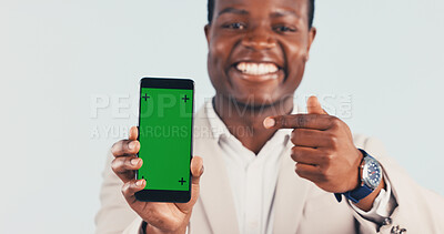 Buy stock photo Pointing, green screen and hands of black man with phone for advertising finance loyalty app. Happy, portrait and financial advisor with cellphone mockup for internet banking on studio background.