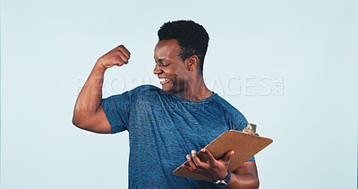 Buy stock photo Clipboard, fitness and black man flexing in studio for muscle and body building training. Checklist, gym sign up and African personal trainer with smile for biceps challenge on white background
