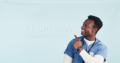 Buy stock photo Space, nurse and man in studio pointing for health news, announcement and medical service. Mockup, happy and African person with gesture for healthcare, wellness tips and info on blue background