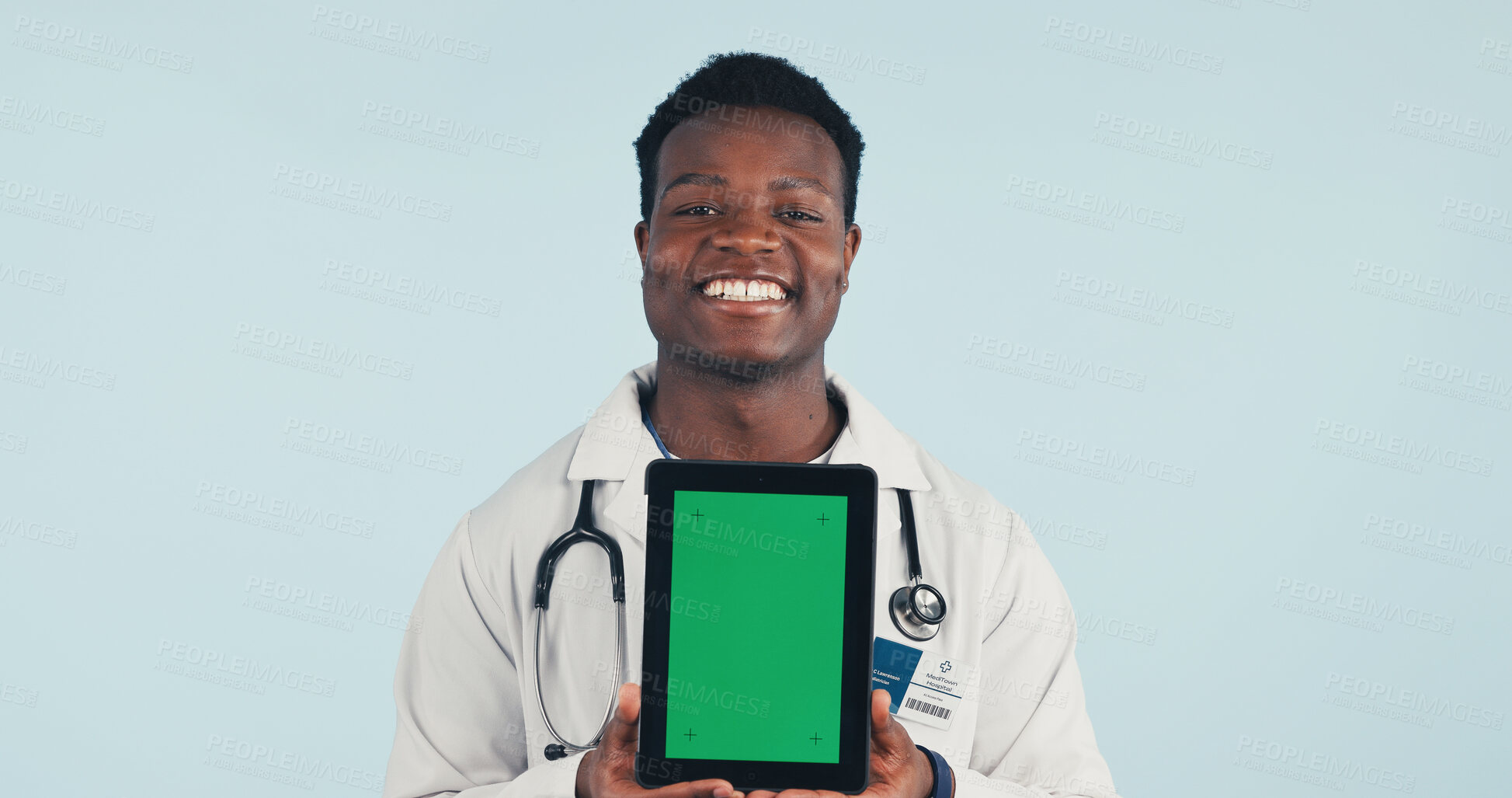 Buy stock photo Portrait, tablet and African doctor with green screen, mockup space or healthcare news. Happy, advertising and man on tech for medical service, telehealth app or wellness info on studio background