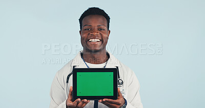 Buy stock photo Doctor, tablet and portrait of man with green screen, mockup space and healthcare news. Happy, advertising and African person on tech for medical service, telehealth app and info on studio background