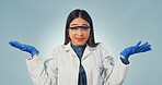 Portrait, scientist and woman in studio with shrug, goggles and confused for medical research options. PPE, person and decision with healthcare science, uncertainty and question on blue background.