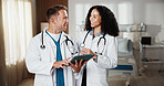Healthcare, laughing and tablet with doctors in hospital together for advice, discussion or feedback. App, collaboration and funny with medical people in clinic for help, support or wellness review