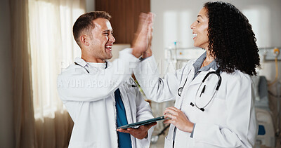 Buy stock photo High five, smile and tablet with doctors in hospital together for goals, success or target. App, celebration and collaboration with happy medical people in clinic for agreement, deal or support