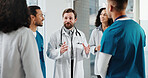 Doctor, nurse and meeting in hospital with discussion, smile and instructions for medical service. Healthcare worker, happy people and manager talk in clinic with advice, update and collaboration.