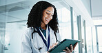 Healthcare, reading and tablet with doctor in hospital for review of feedback or information. App, planning and scrolling with happy woman in clinic for diagnosis or research as medical professional