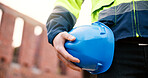 Construction, helmet or hand outdoor with safety, protection gear or ppe uniform in building project. Man, site or hardhat for risk control, compliance or hazard prevention in industrial industry.
