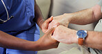 Nurse, support and holding hands in retirement home with old man, sympathy and compassion for grief. Caregiver, senior person and comfort on couch with kindness, understanding and empathy for loss.