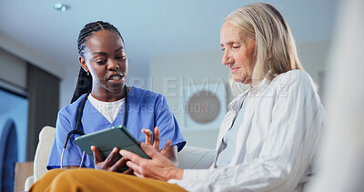Buy stock photo Medical, tablet and nurse talking to old woman in home living room for consulting or feedback. Conversation, healthcare app and support with caregiver on sofa to explain results to senior patient