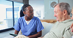 Nurse, discussion and tablet in house with old man, medical advice and wife support for wellness. Married elderly people, caregiver and conversation in home with tech, health checkup and assistance.