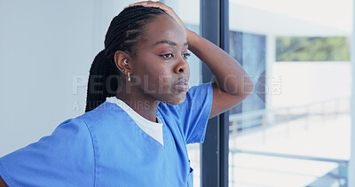 Buy stock photo Nurse, window and black woman thinking in hospital with reflection for memory or mental health. Thoughtful, female person or contemplating ambition for mistake or fail in medical nursing 
