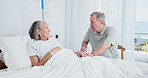 Senior, couple or holding hands with patient in nursing home for medical support together. Elderly, man and talking with woman on drip in bed retirement for healthcare, help or commitment in house