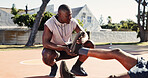 Basketball court, help and black man with pain in leg, accident or support with first aid outdoor. Game, friends and player with sports injury on ground for fitness, training and muscle cramp