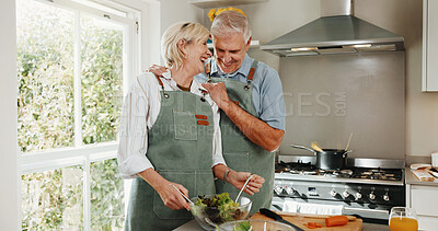 Buy stock photo Cooking, support and old couple in kitchen with food, love bonding together and laugh for funny joke. Happy, married senior people and meal prep in home with wellness, humor and healthy nutrition.