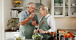 Cooking, support and old couple in kitchen with tasting, connection and bonding with meal prep. Retirement, food sampling and elderly people with spoon, healthy relationship or culinary hobby in home