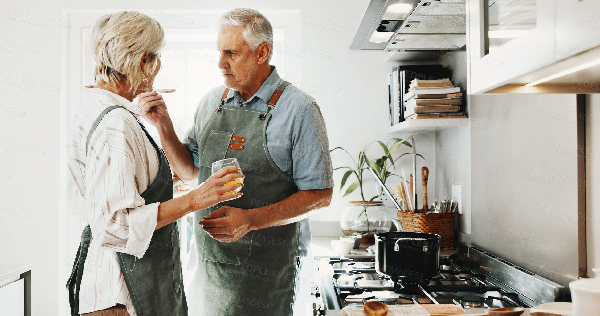Buy stock photo Cooking, taste and senior couple in kitchen for prep, bonding and helping with supper in home. Marriage, happy and man with woman with spoon, drink and test for dinner, lunch and meal together