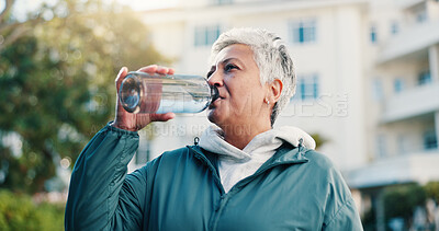 Buy stock photo Exercise, drink and senior woman in city for rest, workout recovery and hydration with bottle. Fitness break, active retirement and person with water for health, beverage and thirsty with runner