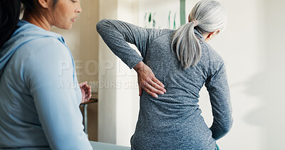 Buy stock photo Chiropractor, help and old woman in clinic with back pain, consultation and assessment for healing. Senior person, chiropractic worker and spine injury in office for evaluation, support or assistance