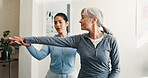 Physio, old woman and stretching in office for checkup, assessment and recovery from injury. Physiotherapist, helping and senior person at clinic for physiotherapy, evaluation and healing arthritis