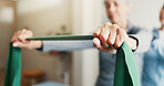 Hands, rehabilitation and resistance band with people in session together for exercise or healing. Fitness, physiotherapy and recovery of old person with chiropractor in health clinic for consulting