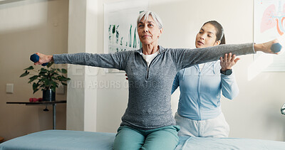 Buy stock photo Physio, old woman and stretching for checkup with dumbbells, assessment and mobility recovery. Physiotherapist, help or senior person in office for physical therapy, fitness and muscle rehabilitation