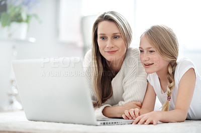 Buy stock photo Mother, child and watching movie in home with laptop, bonding together and online website for cartoon. Happy, woman and daughter on lounge floor with computer, entertainment and streaming kids show.
