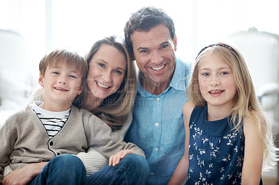 Buy stock photo Happy, relax and portrait of children with parents in home for bonding, love and care on weekend. Smile, pride and kids with mom and dad for family, safety or connection in living room at apartment.