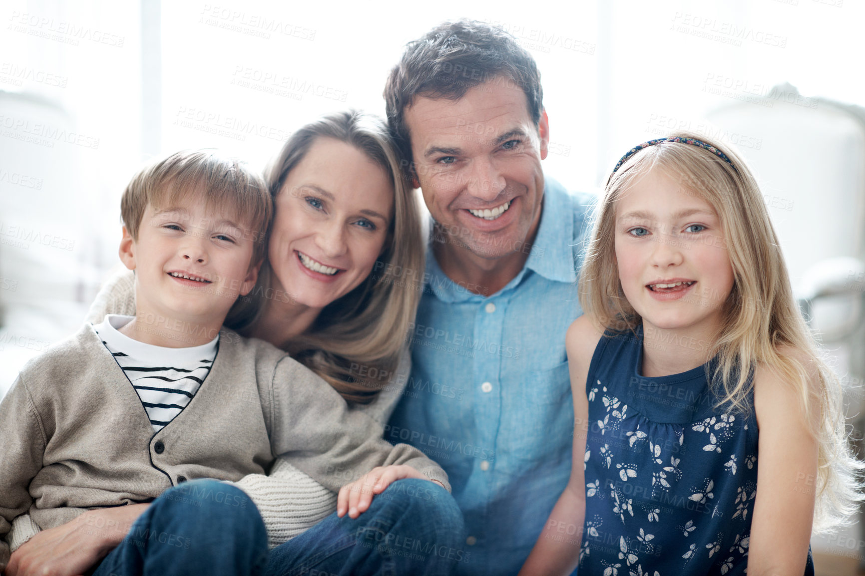 Buy stock photo Happy, relax and portrait of children with parents in home for bonding, love and care on weekend. Smile, pride and kids with mom and dad for family, safety or connection in living room at apartment.