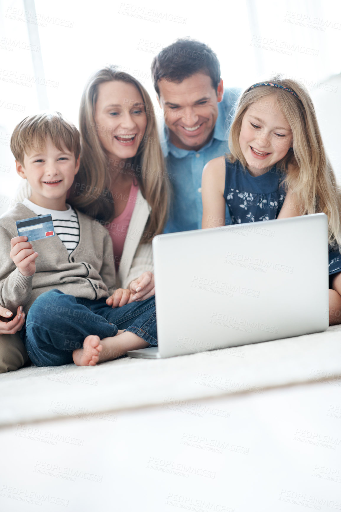 Buy stock photo Laptop, credit card and family in home for online shopping, ecommerce or order on website. Happy, debit and children with parents on computer for internet banking with retail purchase in living room.