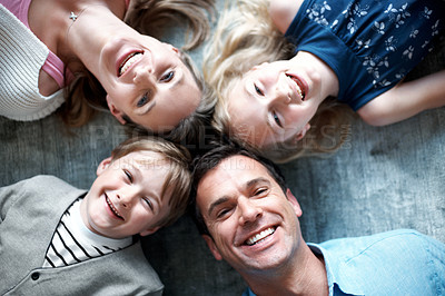 Buy stock photo Portrait, parents and relax on floor with kids, love and parental support for bonding together. Above, people and happiness at house with children, comfortable and family connection for weekend break