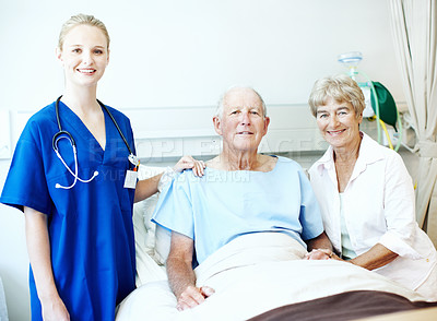 Buy stock photo Portrait, patient and nurse with old couple in hospital bed for medical advice, recovery progress and exam. Healthcare feedback, monitor vitals and diagnosis review with senior people in clinic