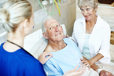 Buy stock photo Smile, patient and nurse with old couple in hospital bed for medical advice, recovery progress and exam. Healthcare feedback, monitor vitals and diagnosis review with senior people in clinic