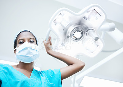 Buy stock photo Surgery, light and portrait of person in hospital for operation, emergency room and nurse pov. Healthcare treatment, face mask and low angle with doctor in clinic for surgeon, career and help