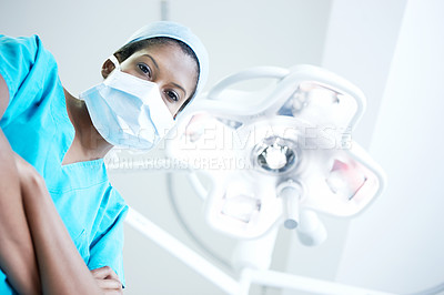 Buy stock photo Arms crossed, face mask and portrait of surgeon in hospital for operation, emergency room and accident. Healthcare treatment, pride and low angle with person in clinic for surgery, career and doctor