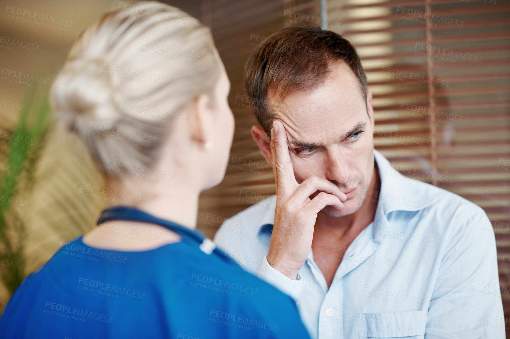 Buy stock photo Nurse, empathy and comfort sad man in hospital with support, compassion or assurance for recovery. Healthcare worker, worried person and help in medical clinic with stress, understanding or sympathy.