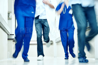 Buy stock photo Running, rush and feet of doctors in hospital for emergency,  motion blur and medical crisis. Accident, healthcare team and wellness with people in clinic for support, urgency and code blue alert