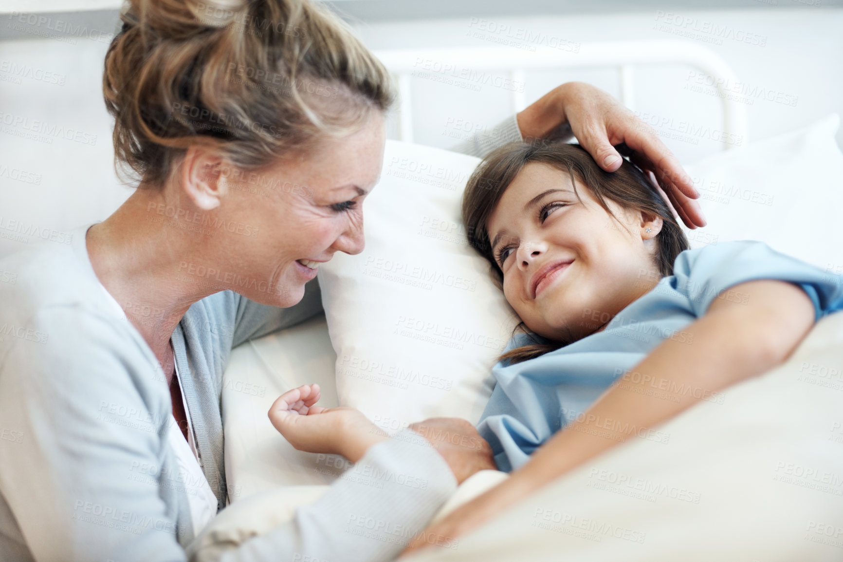 Buy stock photo Happy, mother and sick child in hospital bed with recovery, compassion or support for disease diagnosis. Family, woman and daughter in medical clinic with infection, smile and assurance for healing.