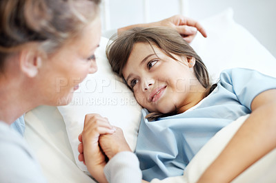 Buy stock photo Mother, comfort and holding hands in hospital bed with sick child, love or support for virus recovery. Woman, console daughter and bonding in medical clinic with connection, empathy or rehabilitation