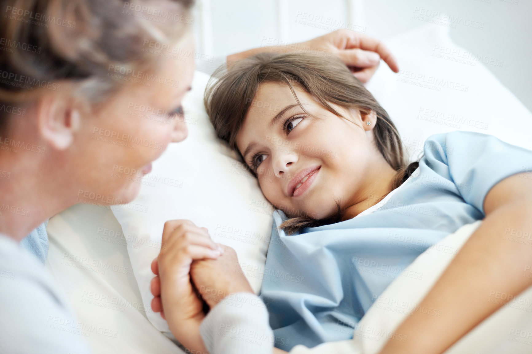 Buy stock photo Mother, comfort and holding hands in hospital bed with sick child, love or support for virus recovery. Woman, console daughter and bonding in medical clinic with connection, empathy or rehabilitation