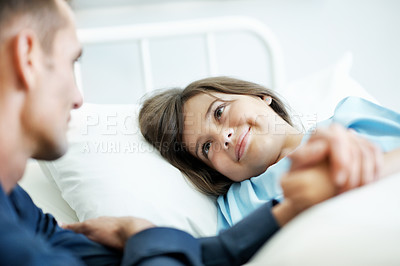 Buy stock photo Father, child and holding hands in hospital bed with smile, love and support for disease recovery. Man, sick daughter and encouragement in medical clinic with care, empathy and assurance for healing.