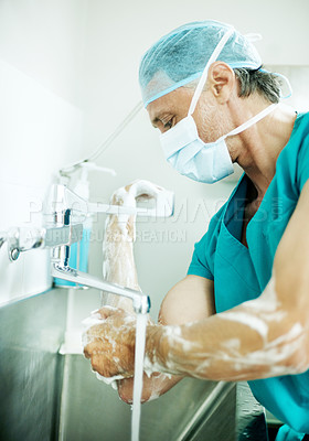 Buy stock photo Hygiene, soap or surgeon with scrub in sink for surgery preparation, infection control and PPE. Mature man, doctor and washing hands in hospital for disinfection, sterile procedure and getting ready