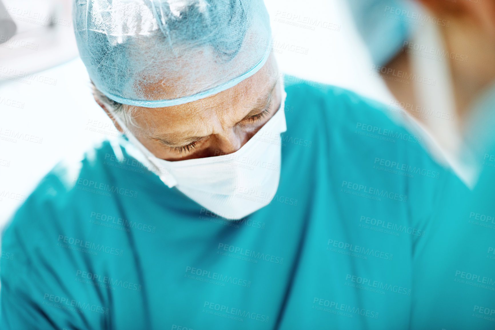 Buy stock photo Surgery, medical and face mask with man in operating room for transplant emergency, help or rescue. Healthcare, accident or procedure with doctor in theater of hospital for organ graft and surgeon